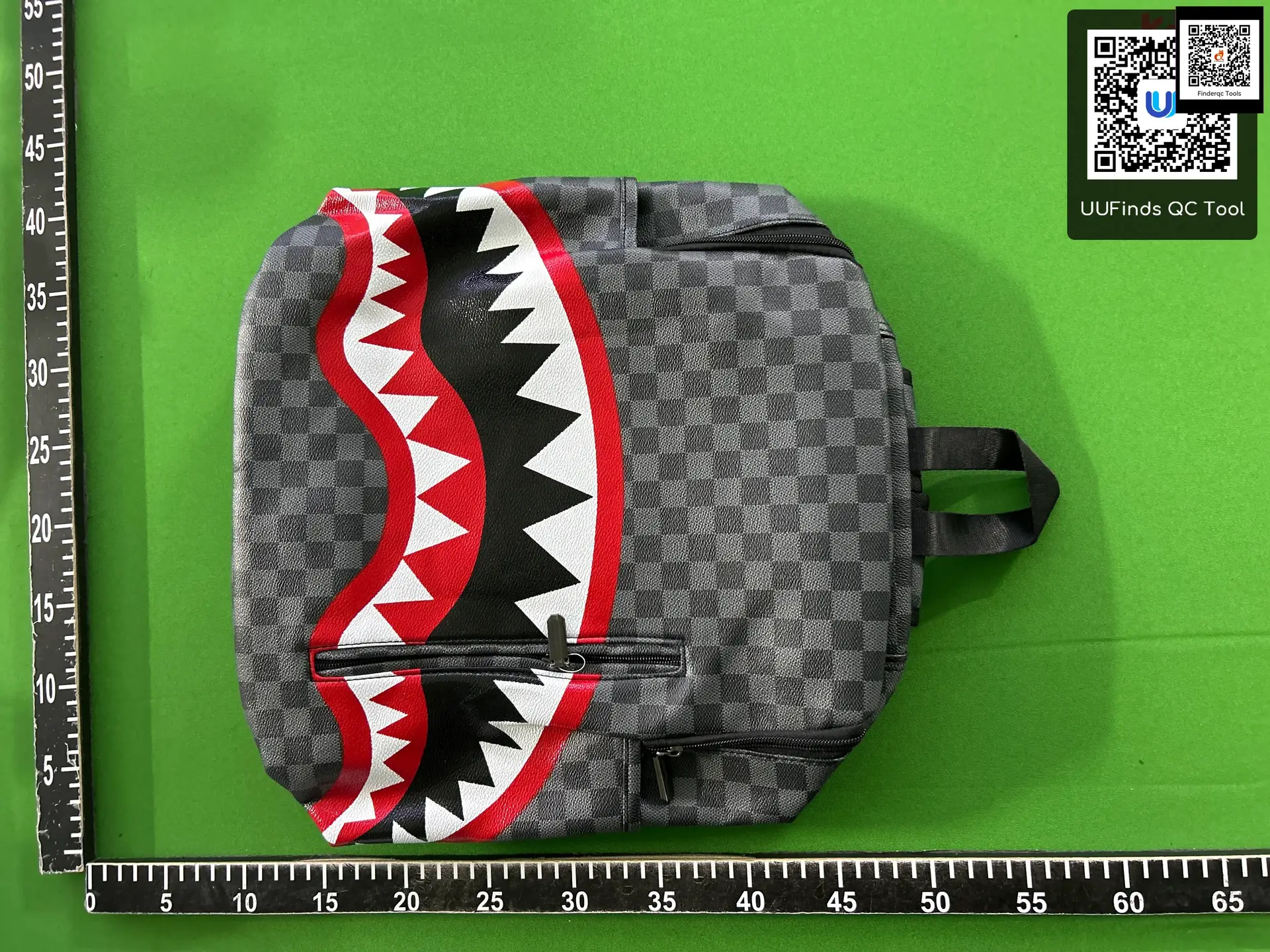 Backpack with shark mouth graphic
