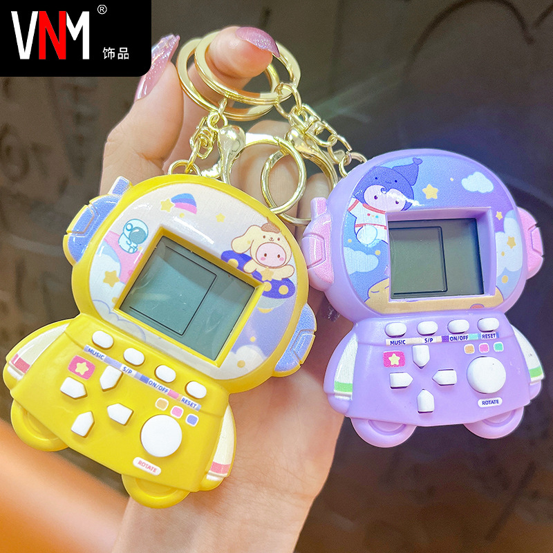 Creative handheld mini astronaut game machine keychain puzzle decompression cartoon creative small pendant school bag pendant