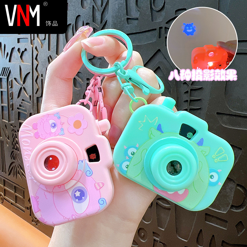 Creative Cartoon Little Monster Three-Eyed Monster Mini Simulation Luminous Projection Camera Keychain Student Toy Small Gift