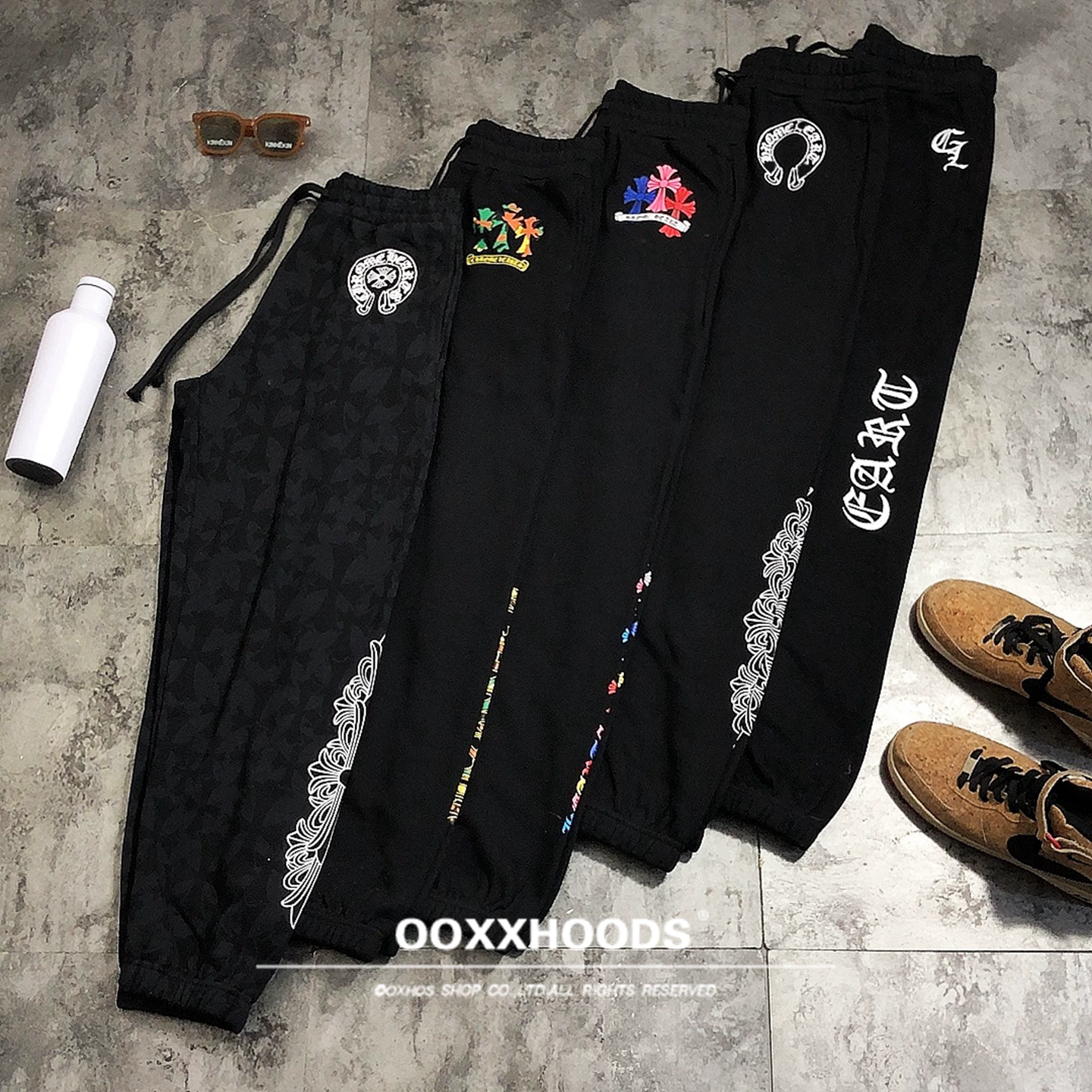 High quality pure cotton looped street style printed flower mouth pants, black cross rune casual pants, trendy and versatile