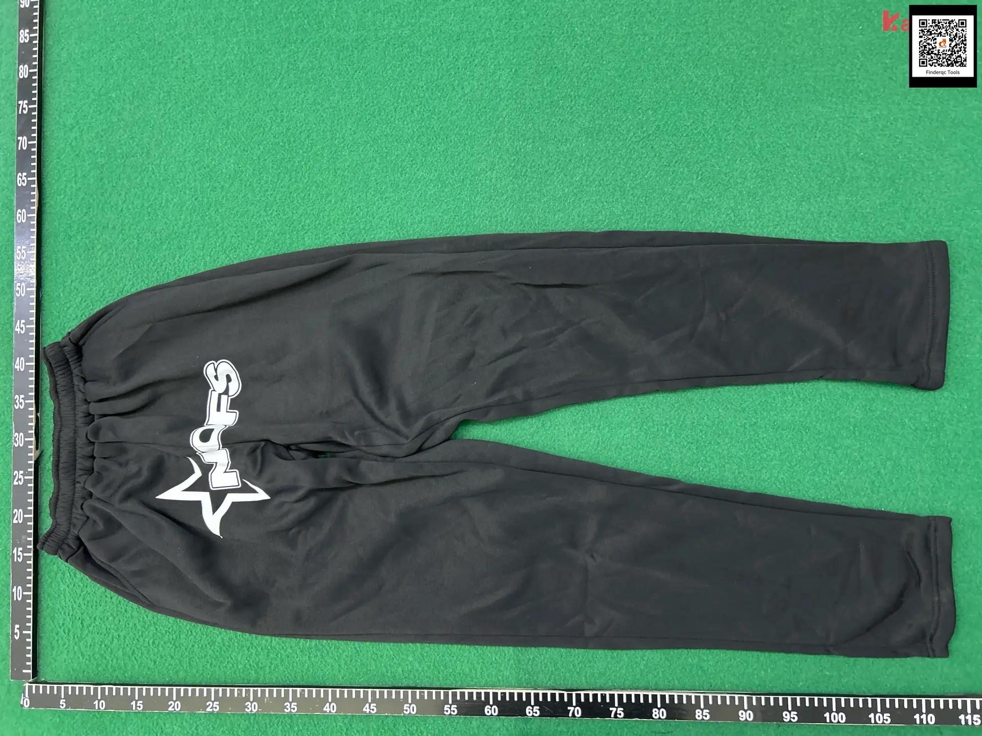 Black athletic pants with white logo