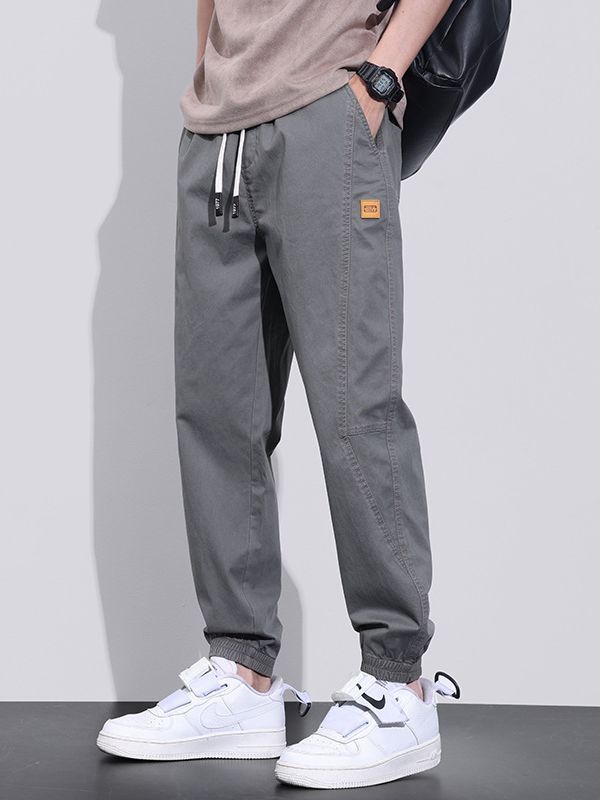 Spring and Autumn New Elastic Waist Stitching Loose Harem Pants Tether Trendy Brand Tooling Sports Large Size Nine-point Tie Pants