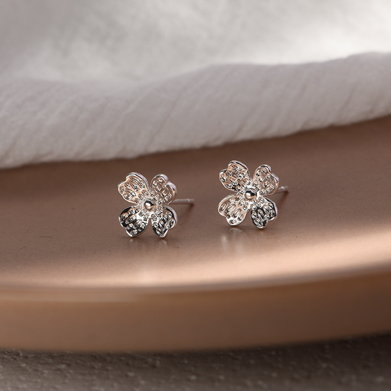 Four-Leaf flower stud earrings female rotating shiny lucky flower ear jewelry fresh Korean style niche design accessories wholesale