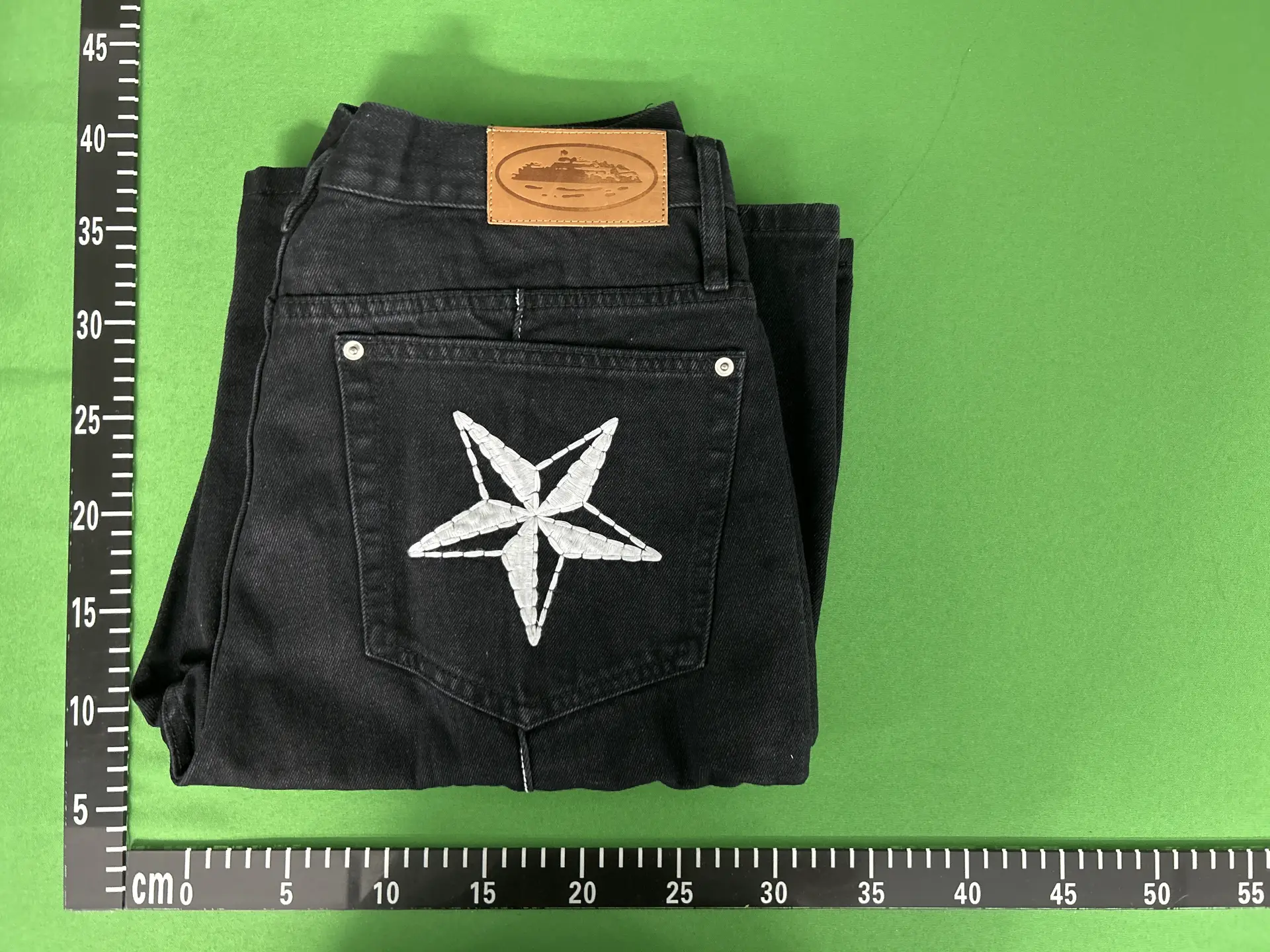 Black jeans with star embroidery