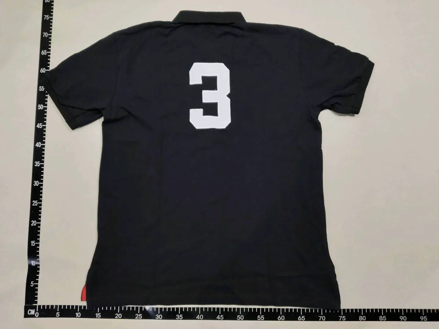 Black Polo Shirt with White Number 3