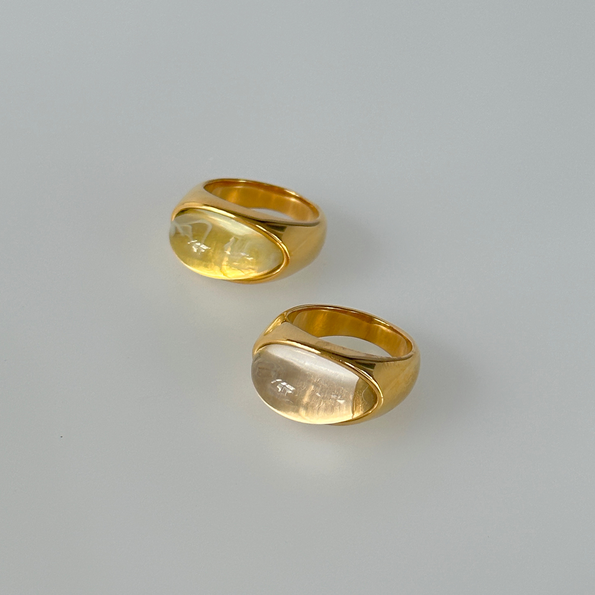 Dazan Wholesale Factory European and American Ins 18K Real Gold Electroplated Titanium Steel Transparent Cat's Eye Dancer Resin Ring