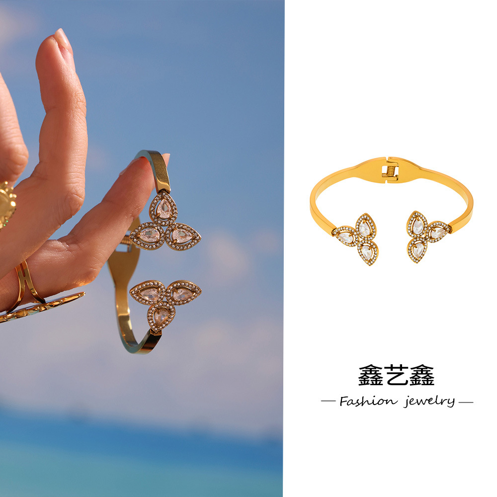 Xinyixinxin Stainless Steel Clover Inlaid with 5A Zircon Open Spring Bracelet Plated with 18K Real Gold European and American New Bracelet