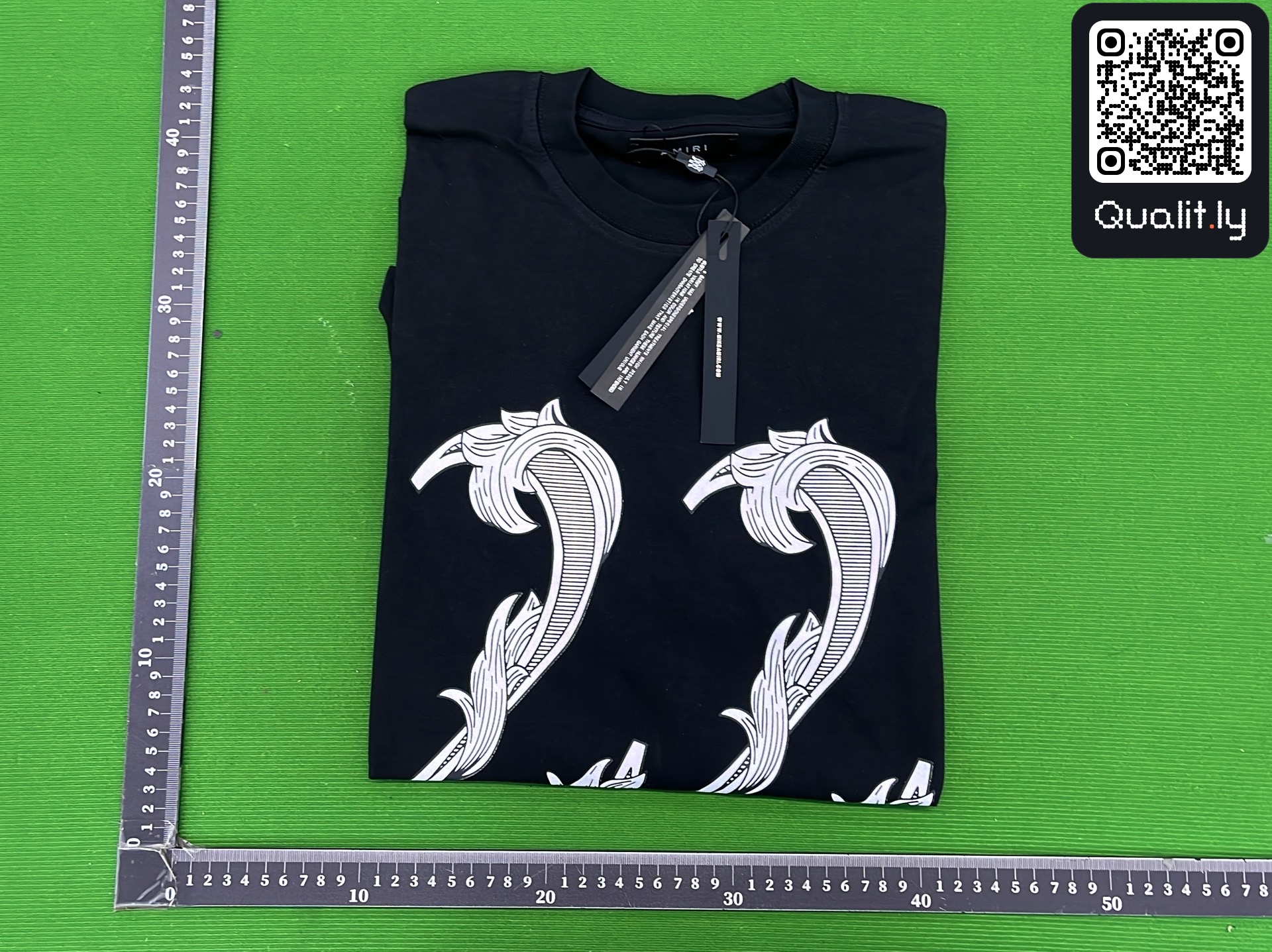 T-shirt — foto QC 1 di 4